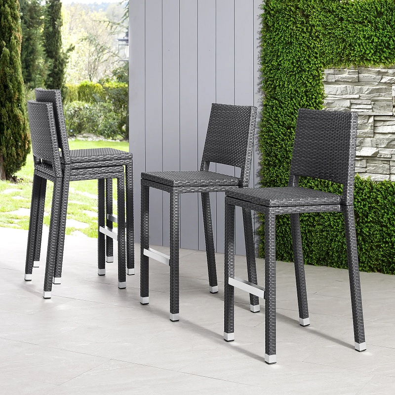 stackable outdoor bar stools made from weather resistant faux rattan wicker construction barstools with backrests exposed metal footrest low maintenance luxury patio stools