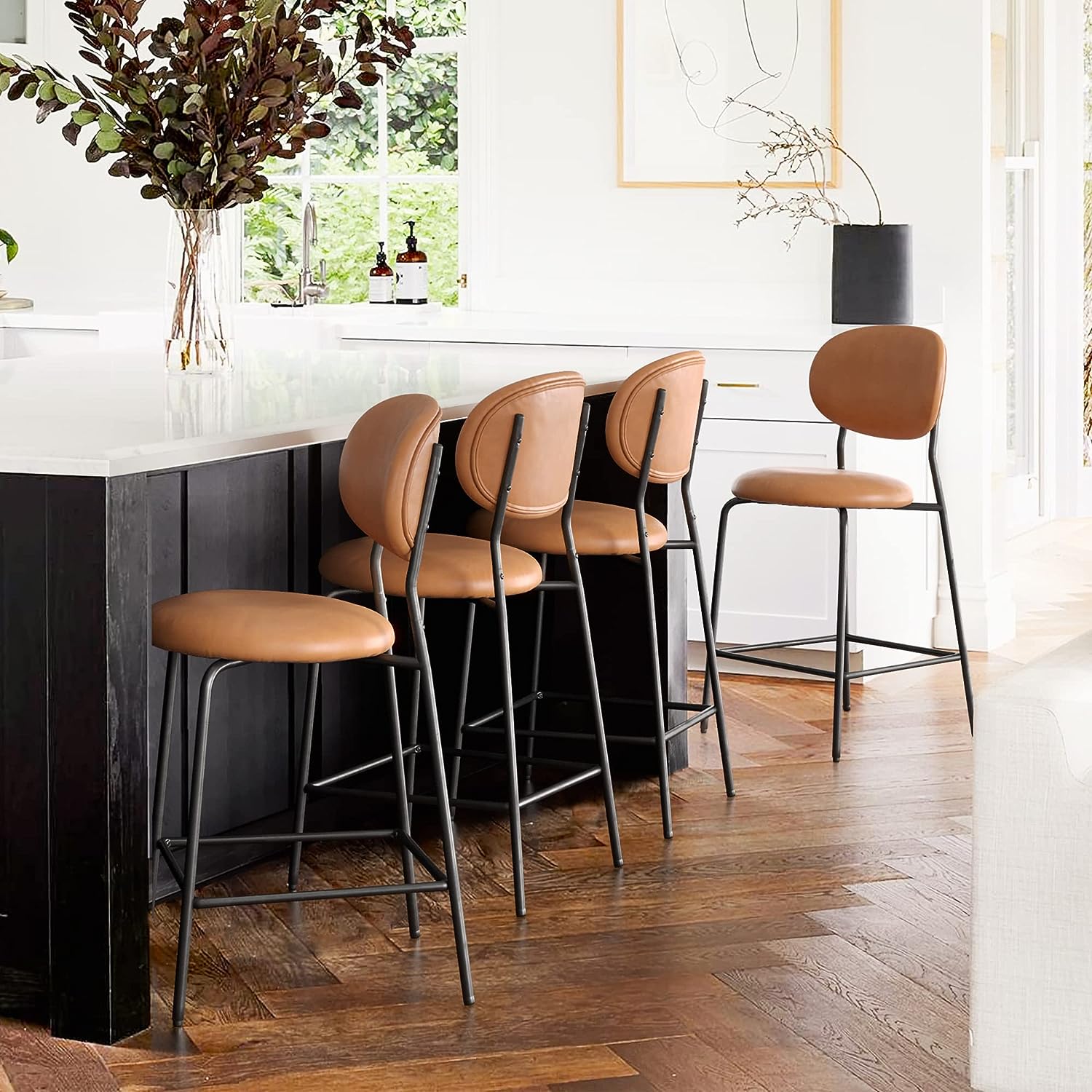 attractive contemporary modern bar stools set of 4 with cognac colored faux leather upholstery round seat and oval backrest black base with footrest counter height seating