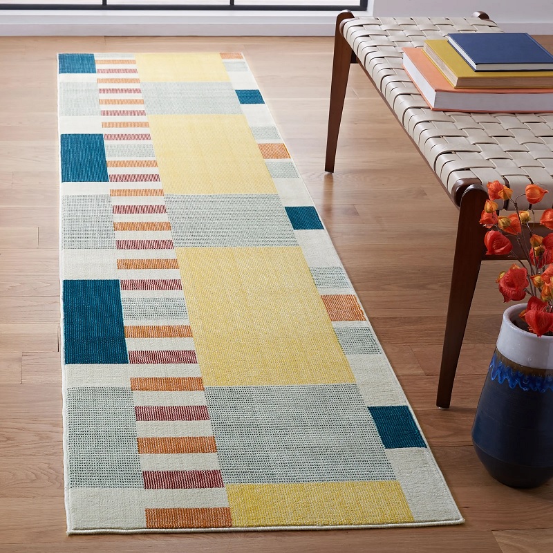 bright and colorful runner rug mid century modern yellow blue red and orange colorway fun geometric pattern retro rugs for kitchens and entryways unique slender runner