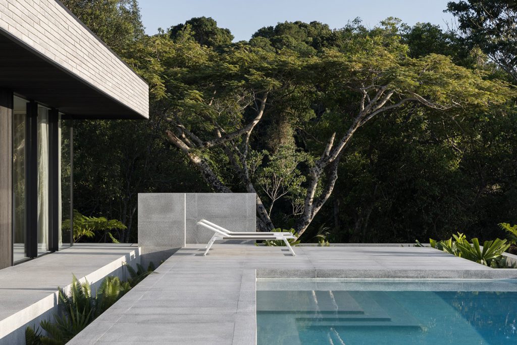 brutalist house with swimming pool