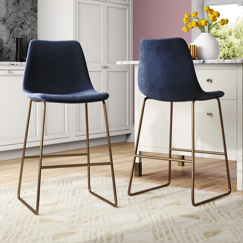 deep navy blue modern counter bar stools with antique brass base and footrest velvet upholstery affordable kitchen barstools with high end designer look luxe decor