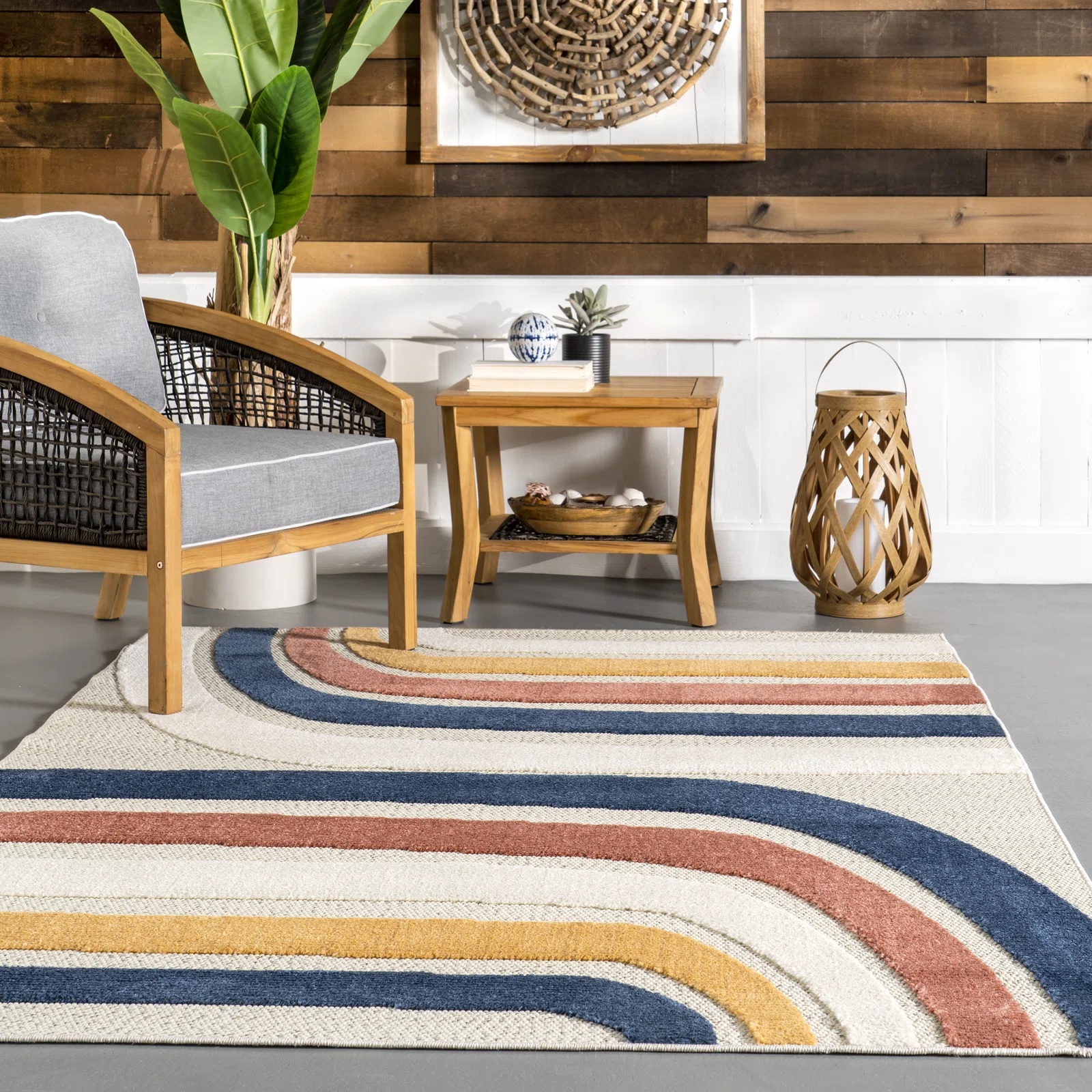 weather resistant mid century modern outdoor rug with colorful curvaceous striped pattern cute retro rugs to use on the patio poolside sunroom decor ideas