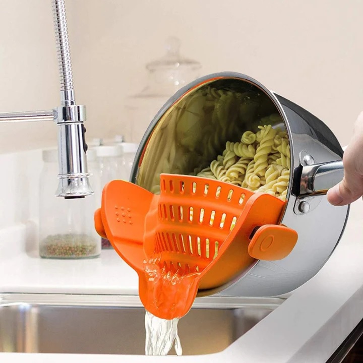 orange snap on pasta strainer convenient kitchen gadget for safety handsfree colander that clips onto the side of a pan space saving kitchen accessories for sale online cheap