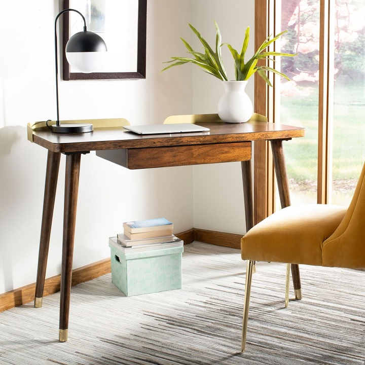 simple brass and wood desk mid century modern with golden back and brass tipped feet ferrrules