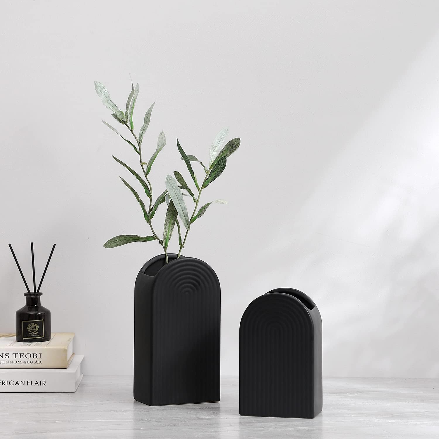 cute black matte vase shaped like an arch postmodern decor and accessories for sale online small dorm room bud vases gen z decor inspiration matte finish geometric shape