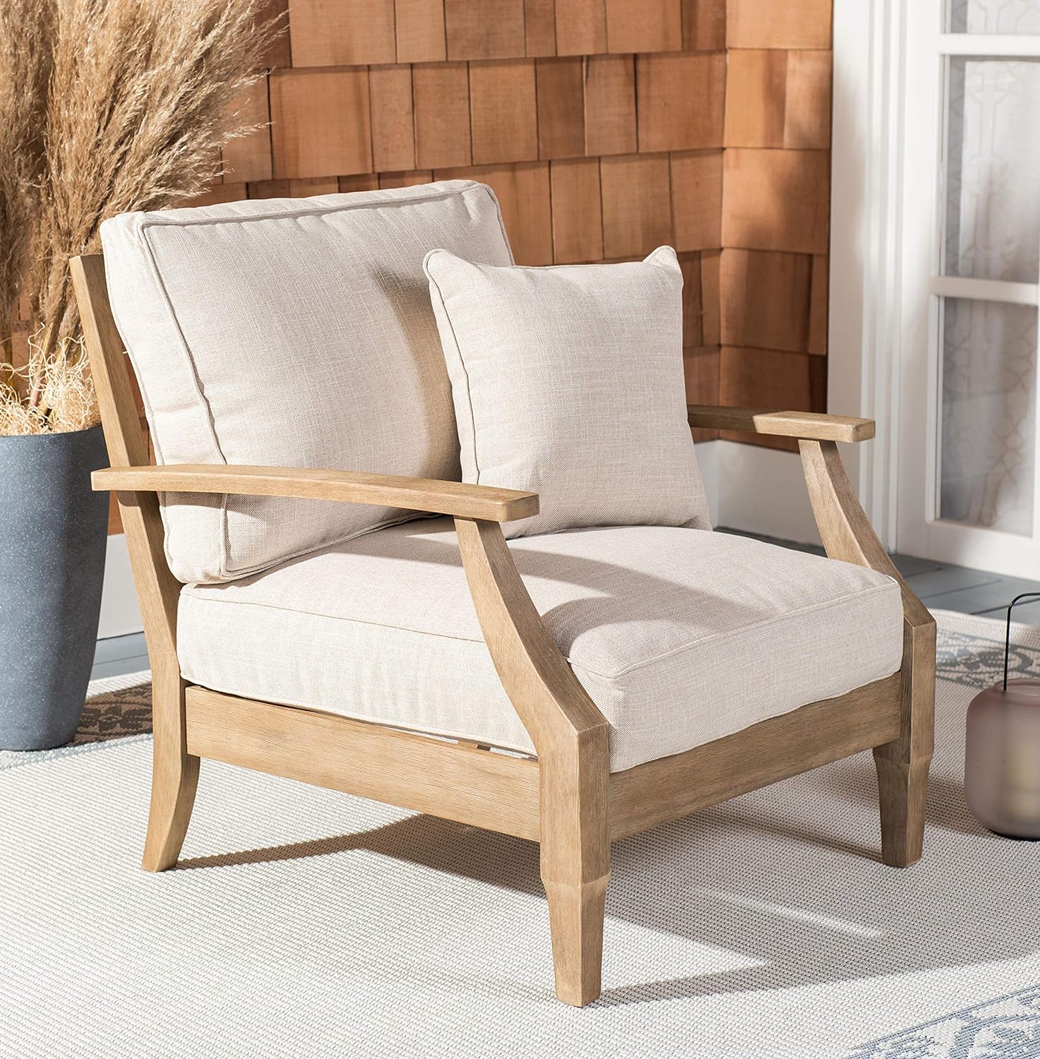 classic wood patio armchair with beige cushions