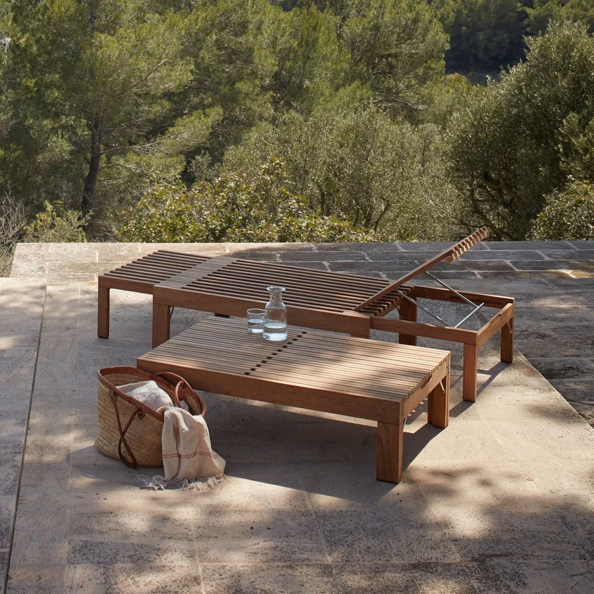 two chaise lounges made from teak slats