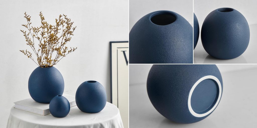 three dark blue ceramic vases with details showing round opening and smooth base