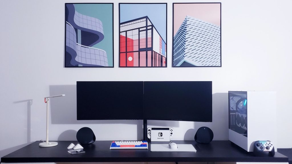 sleek gaming setup with architectural art prints