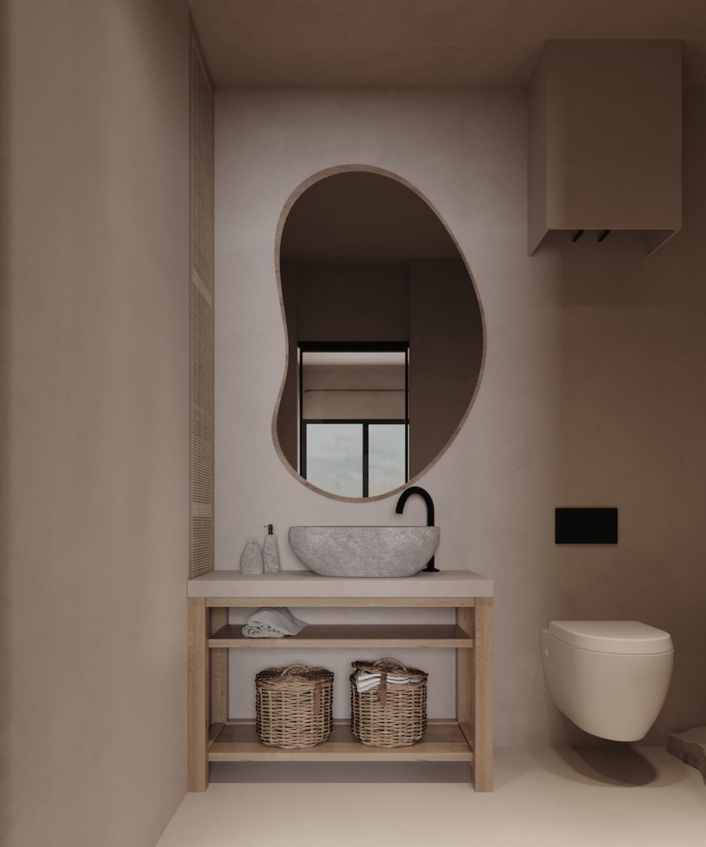 organically shaped mirror over vanity