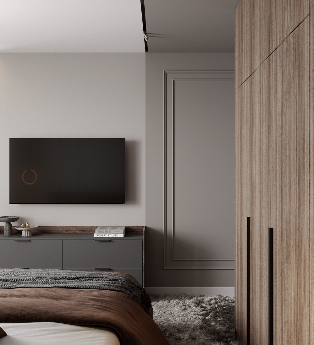 bedroom with sleek entertainment complex and wall mouldings