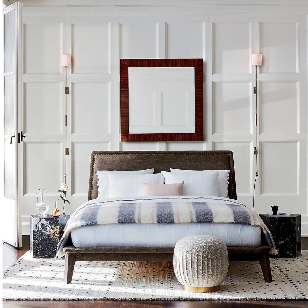 Two plug-in wall sconces flanking a bed