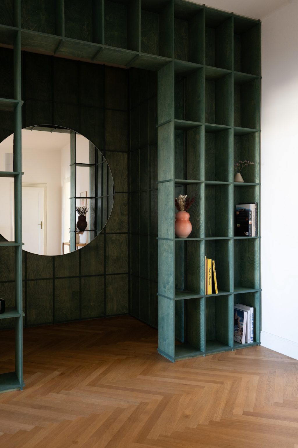 charcoal cabinetry with books and decor