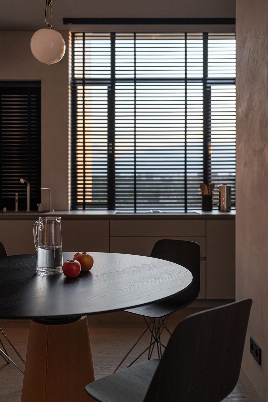 dining table with jug and fruits