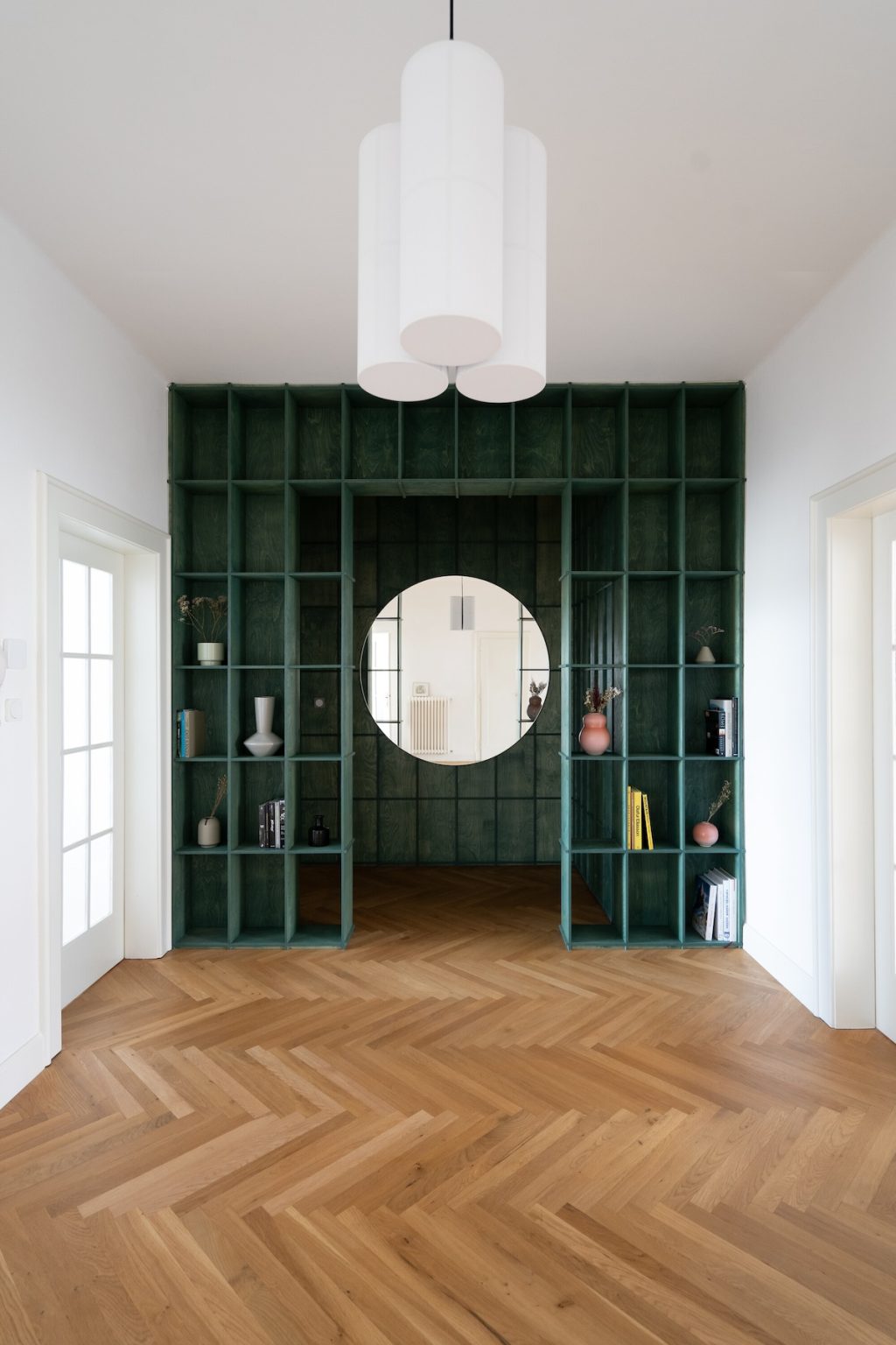 round mirror in cabinetry