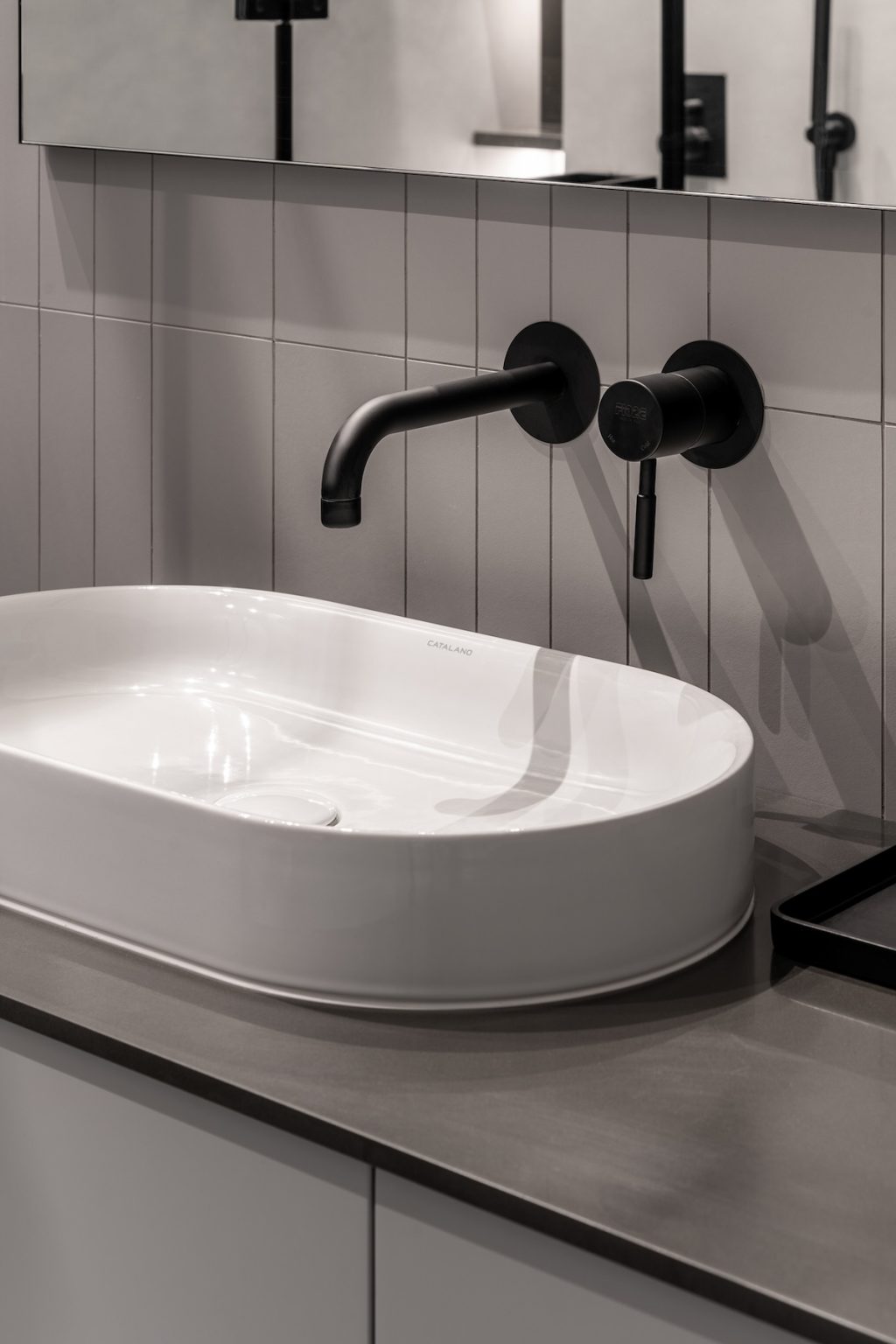 vessel sink and black faucet