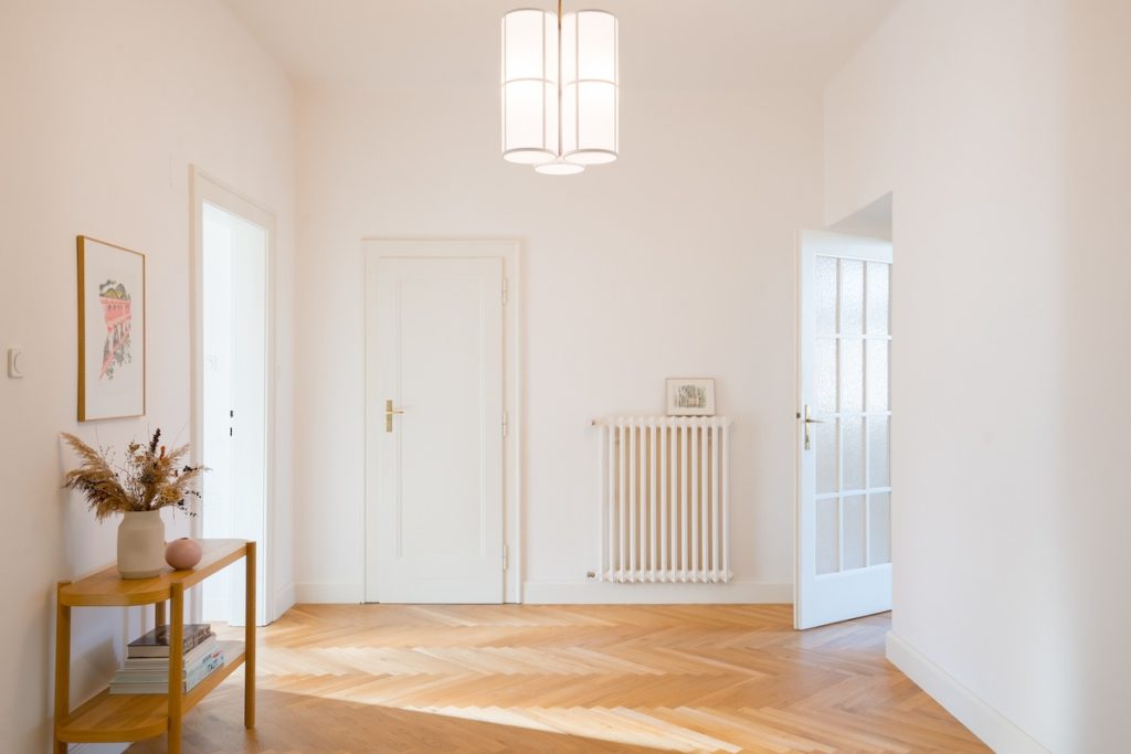 white walls and wooden flooring