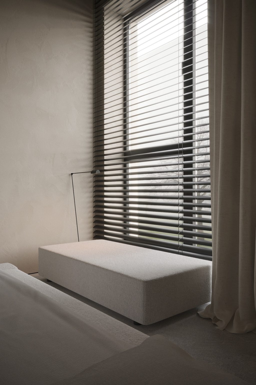 window with blinds next to white seating