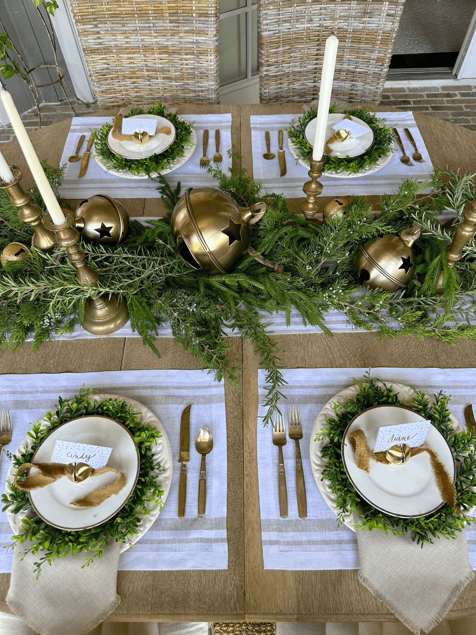 christmas tablescape with gold bells and greenery