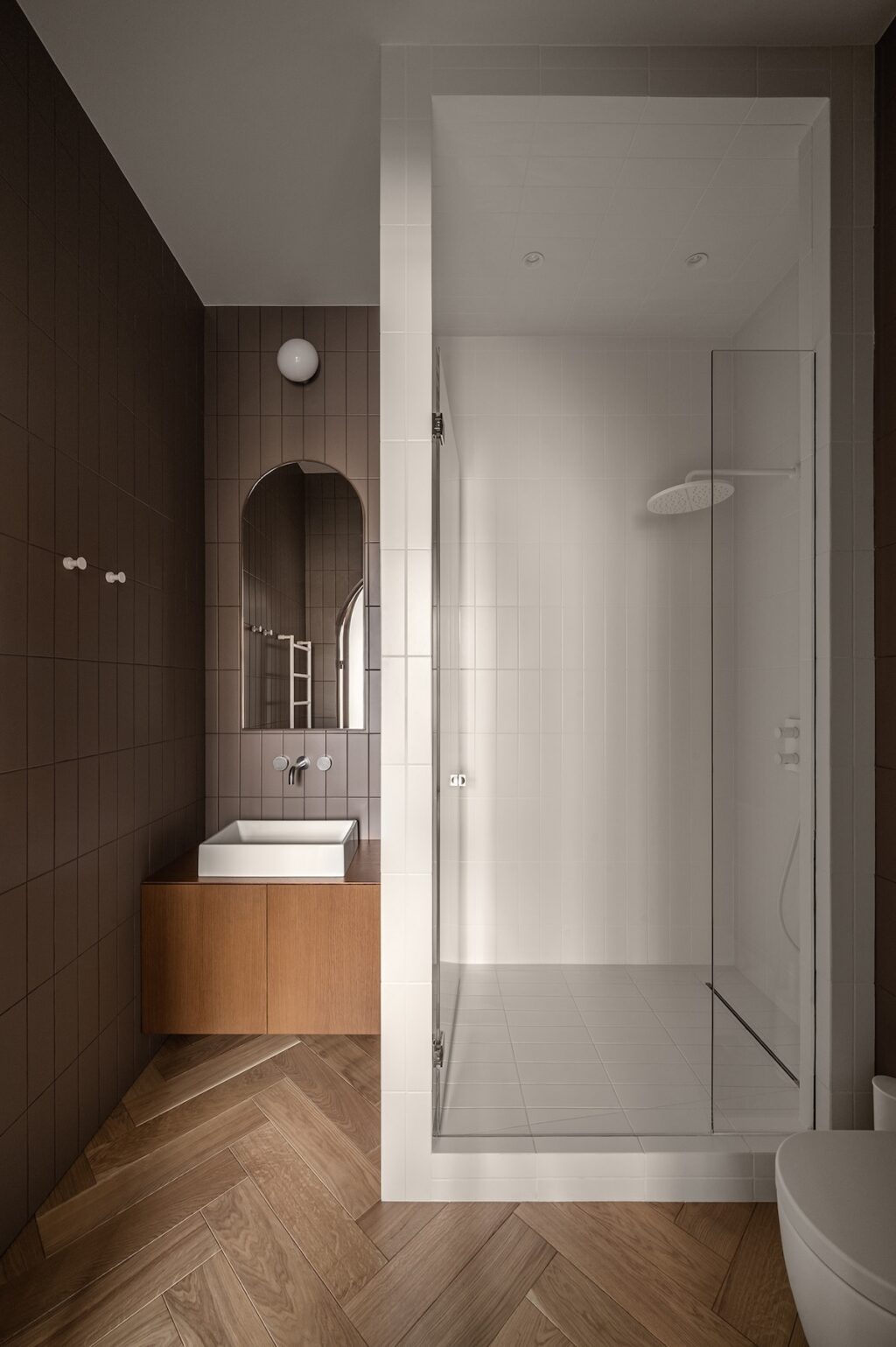 compact bathroom with wall mounted vanity and segregated shower