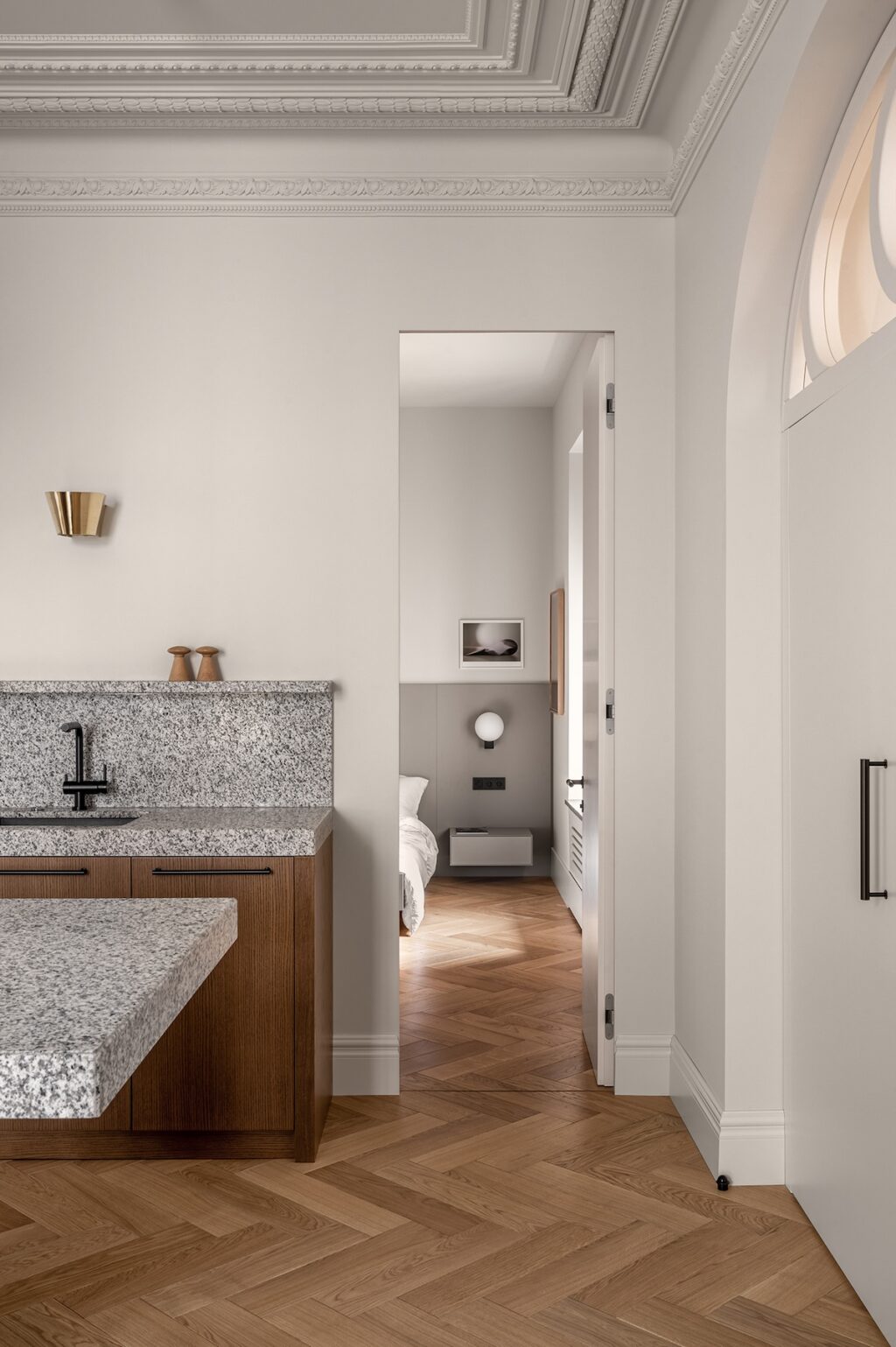 granite kitchen counter leading to serene bedroom