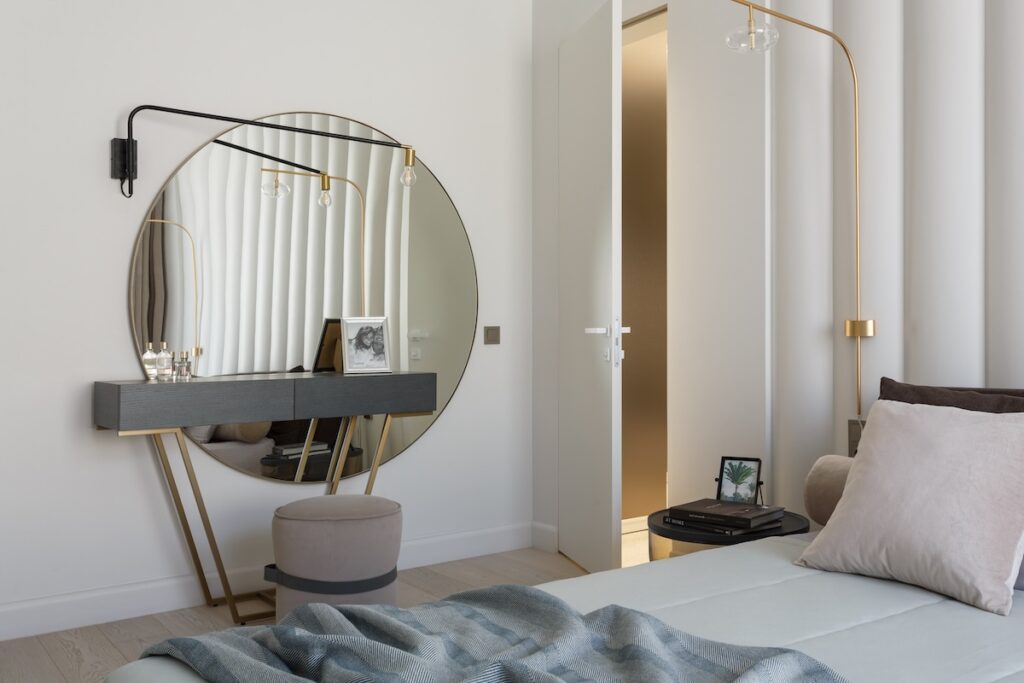 italian bedroom with round mirror dresser