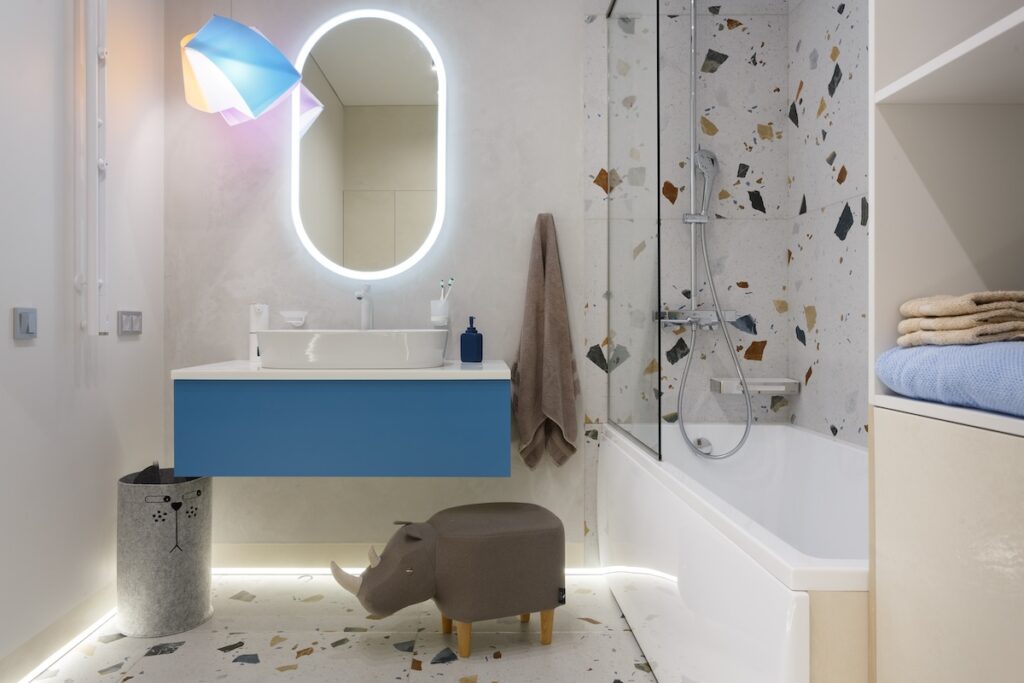 white bathroom with wall mounted blue vanity