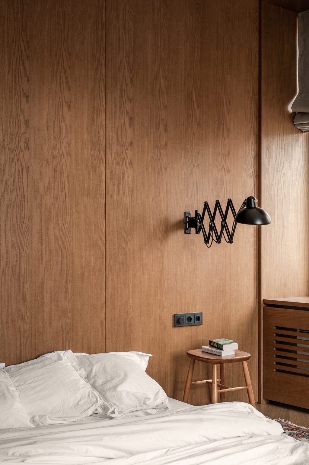 wooden wall with adjustable bedside lamp