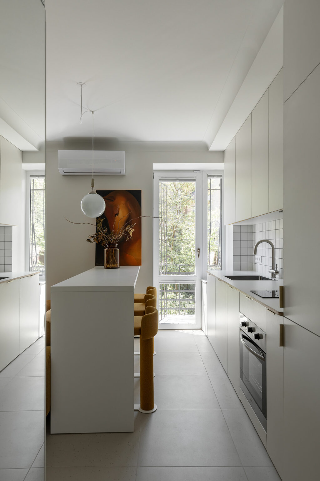 modern and compact kitchen with pops of amber