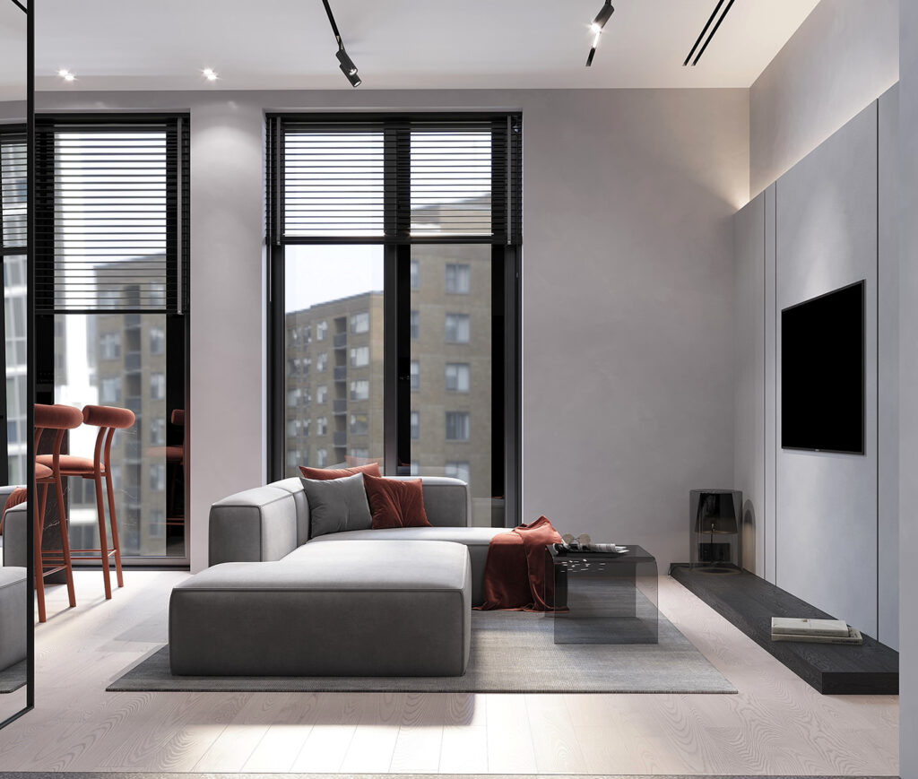 sleek gray sectional and clear coffee table