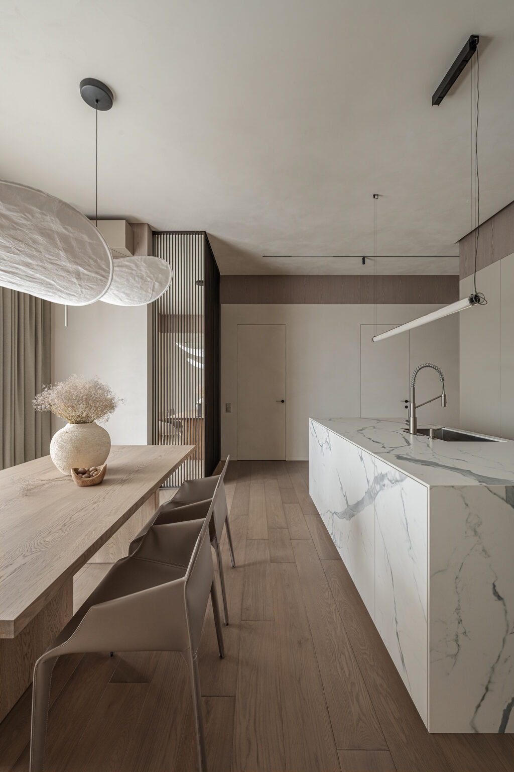 marble kitchen island and wooden dining table