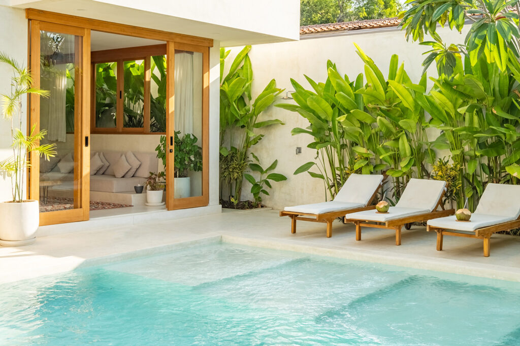 chaise lounges near poolside