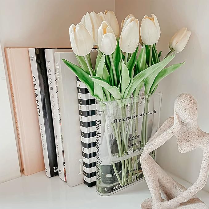 clear book vase with flowers