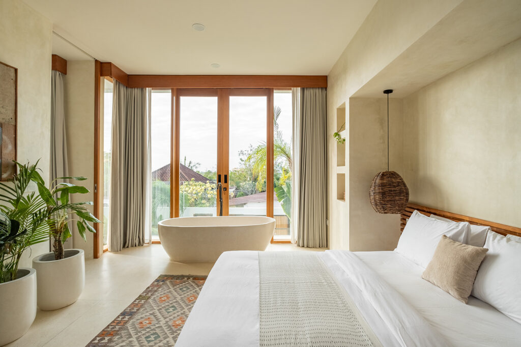 freestanding bathtub in bedroom