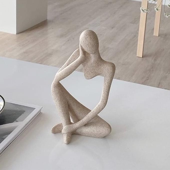 sleek thinker sculpture made from sandstone