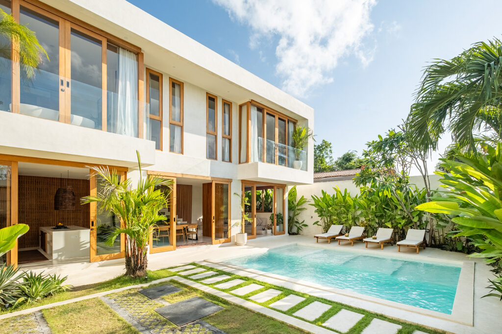 tropical plants near pool