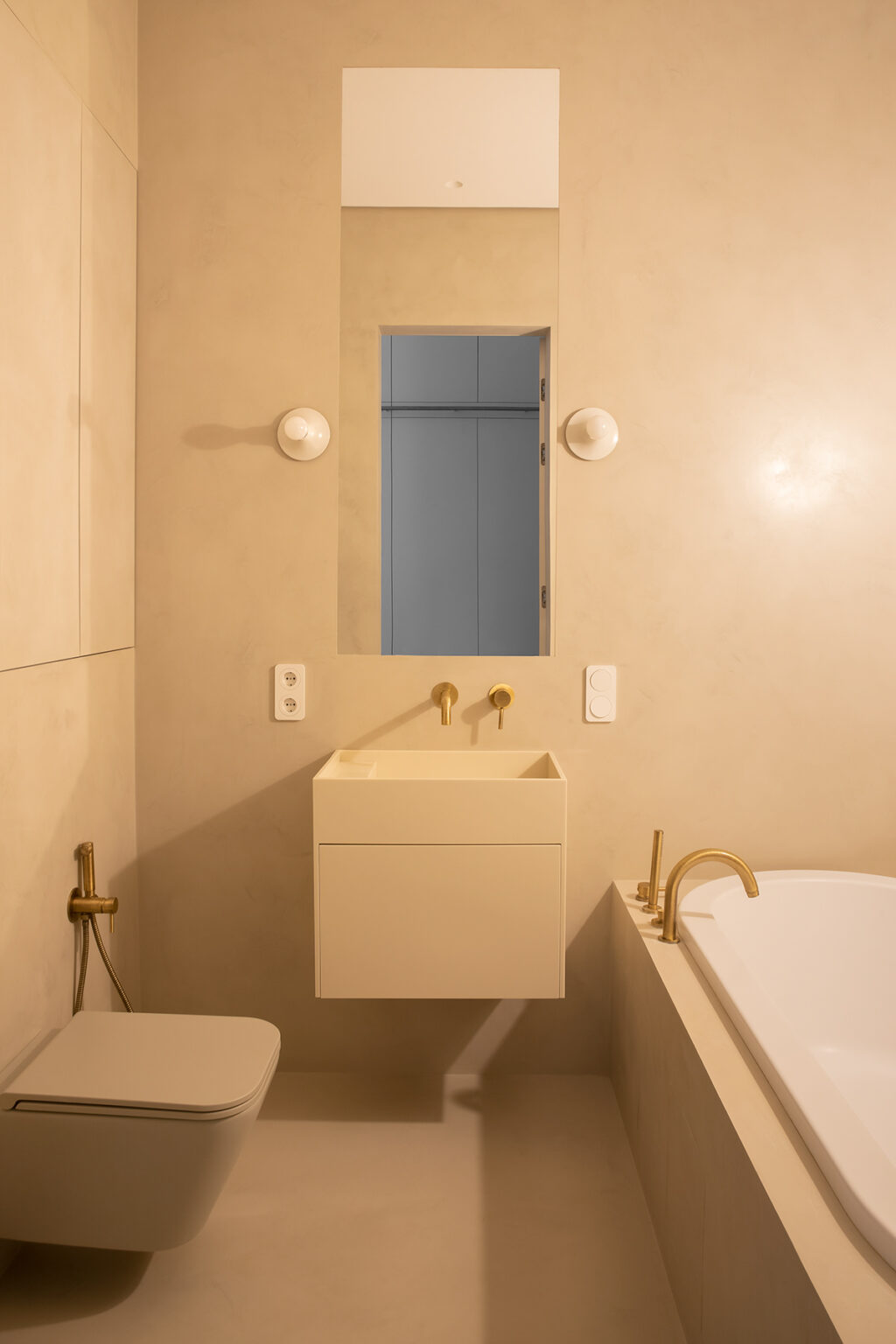 cream bathroom with gold hardware