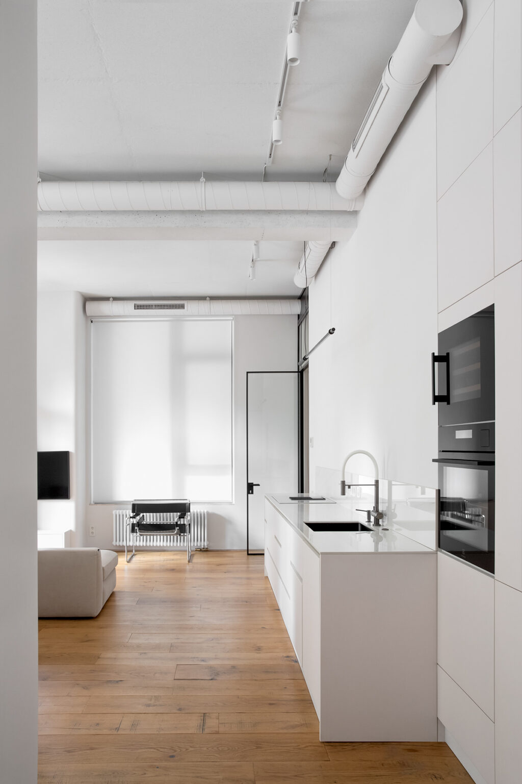 white cabinetry and stainless steel faucet