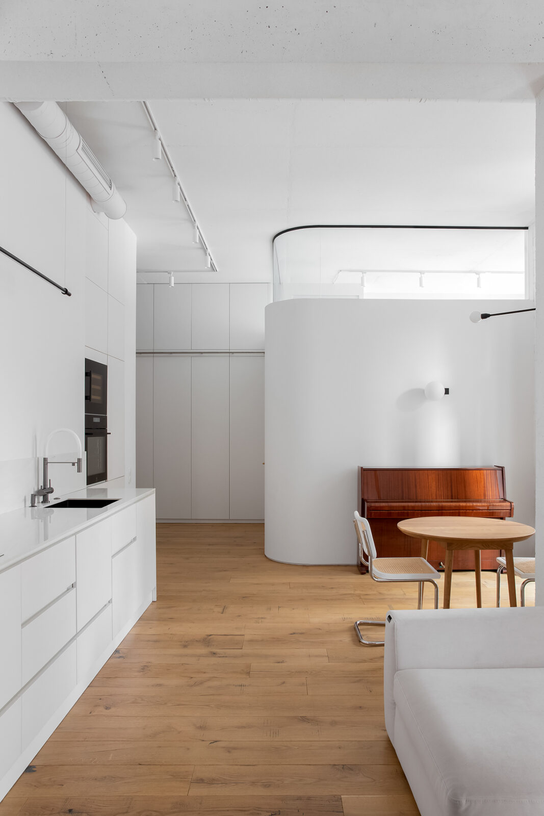 The Alba Apartment: Where All-White Meets Wooden Warmth