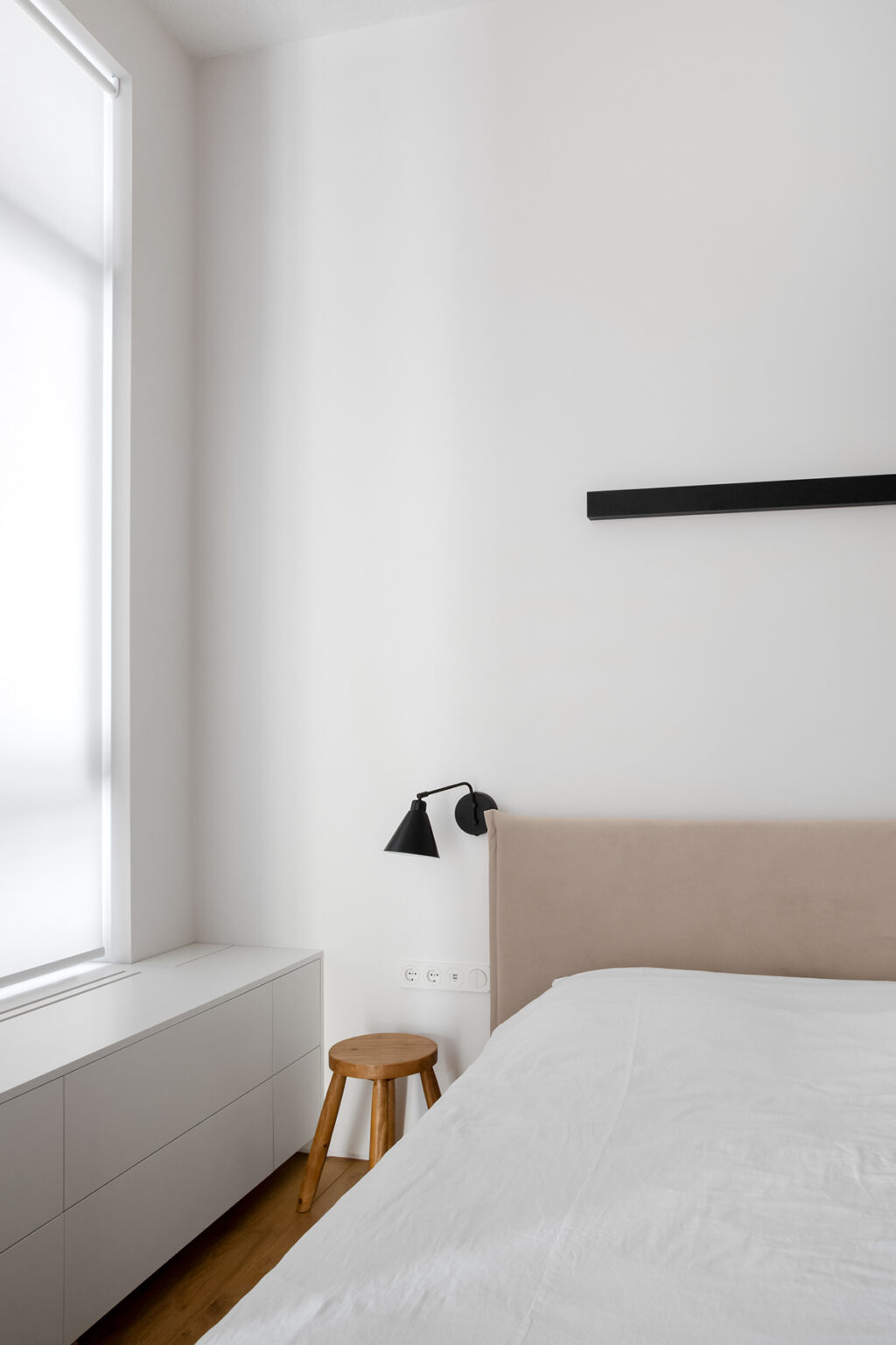 wooden stool as nightstand